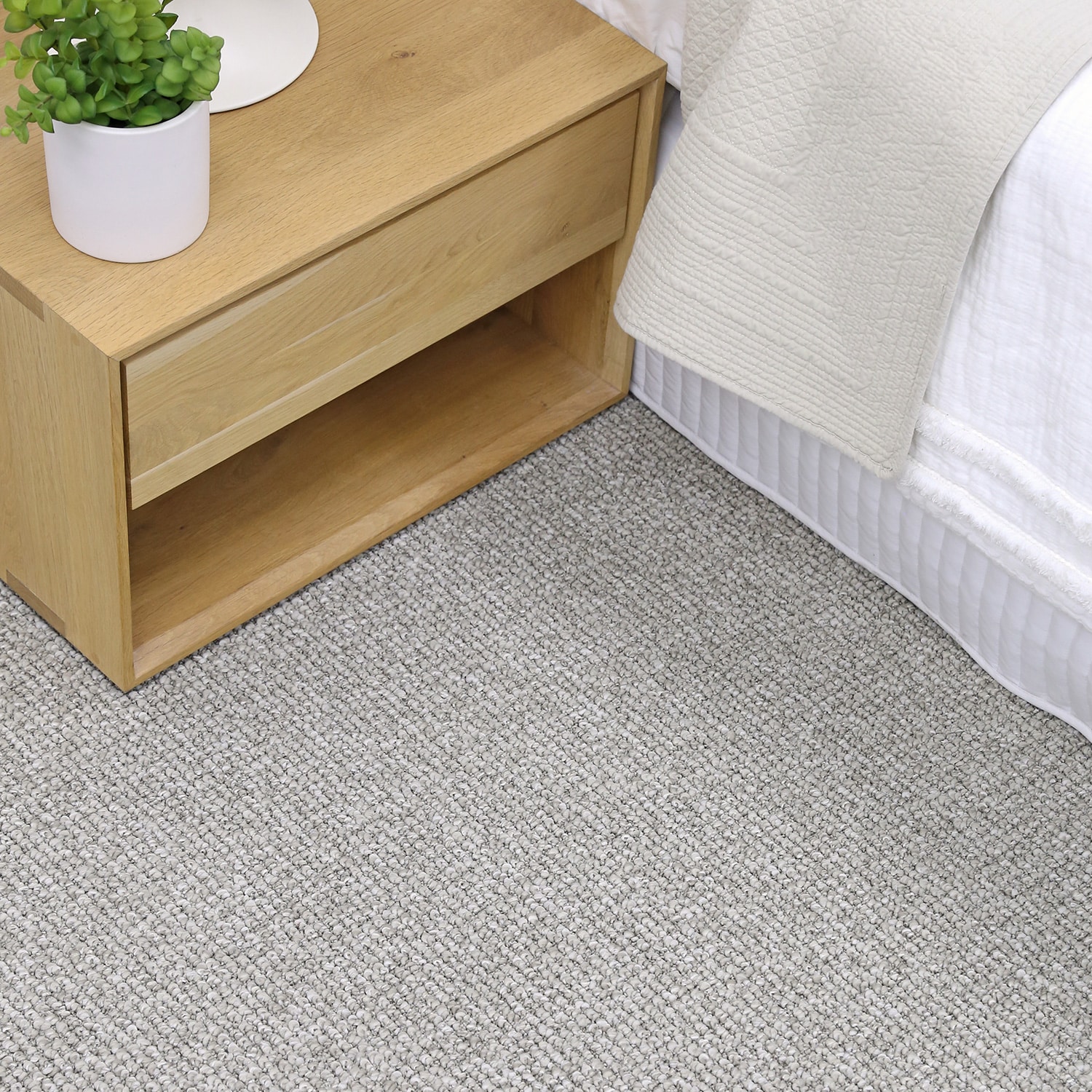 Woodchester in Erimar beside a timber bedside table